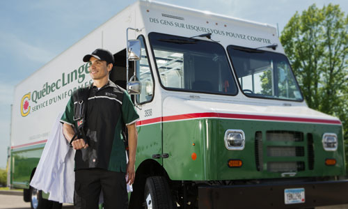 Quebec Linge truck with man delivering uniforms